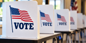 Voting booths with American flags